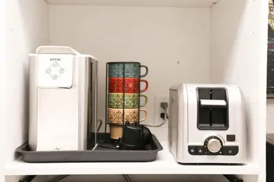 a shelf with a toaster and a toaster on it at Chic Artistic Studio Suite Exceptional Luxury with Everything You Need NO need to SHARE Room in Richmond