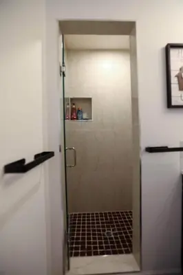 a shower with a glass door in a bathroom at Chic Artistic Studio Suite Exceptional Luxury with Everything You Need NO need to SHARE Room in Richmond