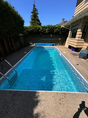 a swimming pool with blue water in a yard at Chic Artistic Studio Suite Exceptional Luxury with Everything You Need NO need to SHARE Room in Richmond