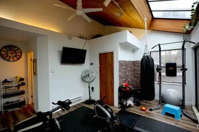 a room with a gym with a ceiling at Chic Artistic Studio Suite Exceptional Luxury with Everything You Need NO need to SHARE Room in Richmond