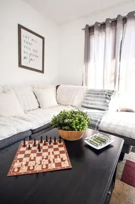 a chess board on a table in a living room at Cozy House in Haines Junction in Haines Junction