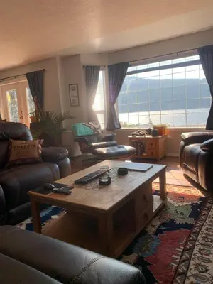 a living room with a couch and a coffee table at Best Bed and Breakfast in Port Alberni