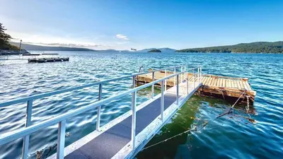 a dock in the middle of a large body of water at OCEAN FRONT 2 BEDROOM SUITE with STUNNING VIEWS in Victoria