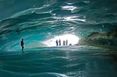 a group of people standing in an ice cave at Glacier Lodge Premiere Suite in Whistler