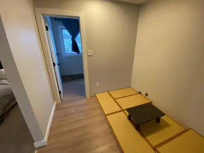 a small room with a bench and a door at Close To Whyte University New Renovation in Edmonton