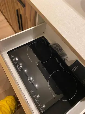 a toaster oven sitting in a drawer in a kitchen at Central 2br Near Unveristy And Whyte Ave in Edmonton