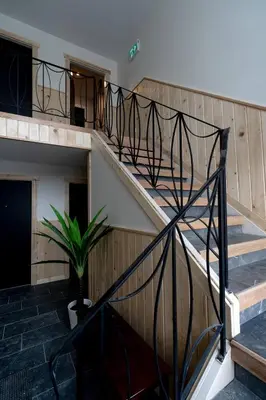 a staircase in a building with a plant at Central 2br Near Unveristy And Whyte Ave in Edmonton