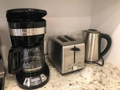 a coffee maker and a toaster on a counter at Modern luxury and convenience in Marda Loop in Calgary