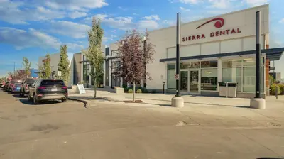 a parking lot in front of a shopping center at Cozy place to stay in south Calgary in Calgary
