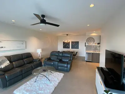 a living room with a couch and a ceiling fan at Winchelsea Views in Nanaimo