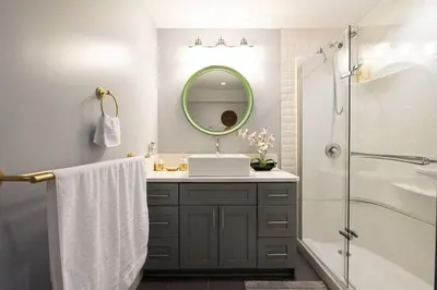 a bathroom with a sink and a mirror at Cozy suite, Free WIFI , Free Parking in Calgary