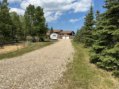 a gravel road in front of a house at Tudor House Bed and Breakfast in Bottrel