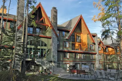 a large house with a staircase leading up to it at 2 Bd Worldmark Canmore Banff Condo in Canmore
