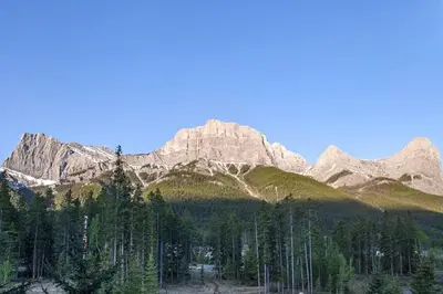 a mountain range with trees in front of it at 2 Bd Worldmark Canmore Banff Condo in Canmore