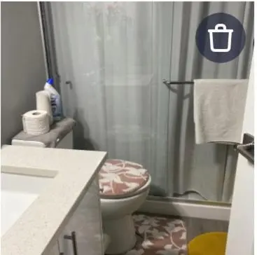a bathroom with a shower and a toilet and a sink at Empress moment place #602 in Calgary