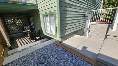 a front door of a house with a porch at The Bainbridge Studio in Burnaby