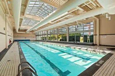 a large indoor swimming pool with a large ceiling at Lovely condo with amazing view in Vancouver