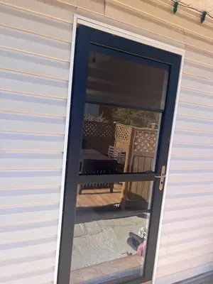 a sliding glass door with a view of a patio at Serenity Bed and Breakfast in Comox