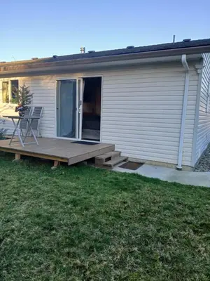 a deck on the side of a house at Serenity Bed and Breakfast in Comox