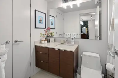 a bathroom with a sink and a toilet and a mirror at Your Own Private Oasis In Victoria in Victoria