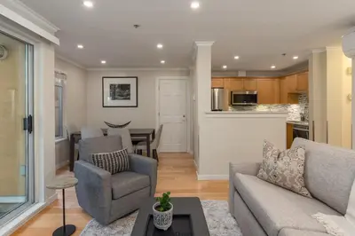 a living room with a couch and a table at 1BR in Sunpath, Epic Village Location, Private Patio, Pool and Hot Tub, Parking in Whistler