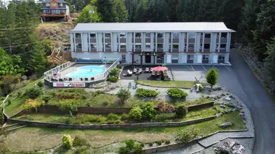 an aerial view of a building with a pool at High Pont Resort in Quathiaski Cove