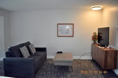 a living room with a couch and a coffee table at High Pont Resort in Quathiaski Cove
