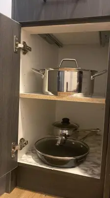 a kitchen with a sink and a pot on a shelf at Pebbles' Cozy 2Bed Basement Suite - near Downtown in Edmonton