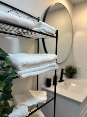 a towel rack in a bathroom with a mirror at New York Style Loft in Downtown Vancouver-Ideal for World Cup 2026, Sleeps 4 in Vancouver