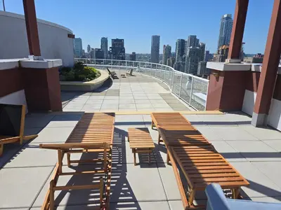 two wooden benches sitting on top of a building at New York Style Loft in Downtown Vancouver-Ideal for World Cup 2026, Sleeps 4 in Vancouver