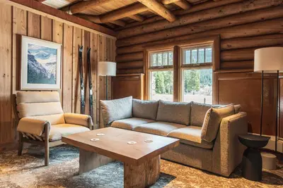 a living room with a couch and a coffee table at The Lodge at Bow Lake in Lake Louise