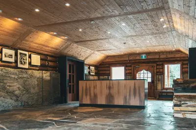 a large room with a table in the middle of it at The Lodge at Bow Lake in Lake Louise