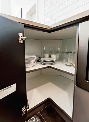 a cupboard with plates and dishes on it at LuxQuarters Bumbleberry Guest House in Kitimat