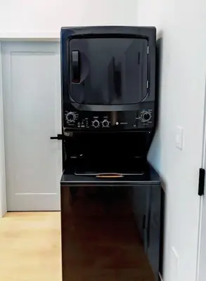 a microwave oven sitting on top of a table at LuxQuarters Blueberry Studio in Kitimat