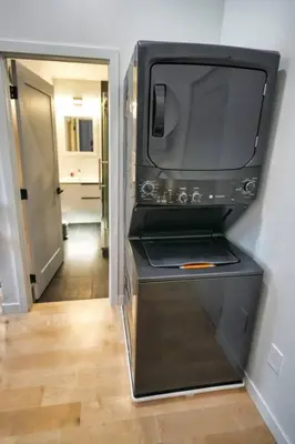 a microwave sitting on a shelf in a room at LuxQuarters Blueberry Studio in Kitimat