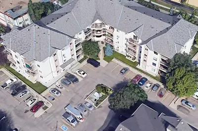 an overhead view of a parking lot of a apartment complex at Chris Cozy Condo Commonwealth #107 Edmonton in Edmonton