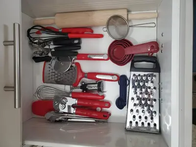 a drawer filled with lots of kitchen utensils at 33 Executive Home, Ac, Airport in Calgary