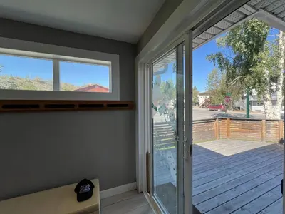 a room with a sliding glass door and a porch at Little Holiday Home in Yellowknife