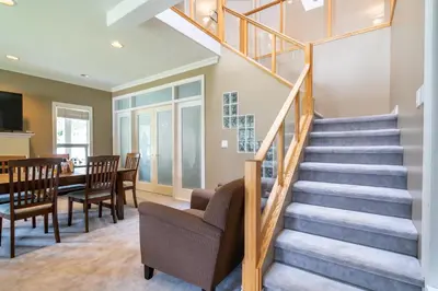 a staircase in a home with a table and chairs at Cornerstone Bed and Breakfast in Revelstoke