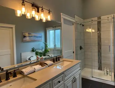 a bathroom with a sink and a shower at Caribou Lodge in Terrace