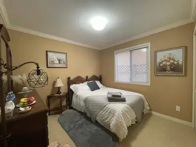 a bedroom with a bed and a window at Terra Nova - Private property in Richmond