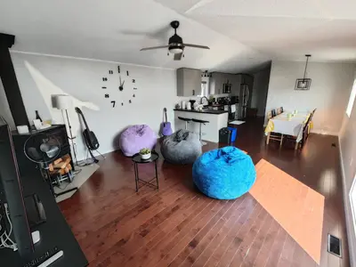 a living room with three bean bags on the floor at EC Lodging in Yellowknife