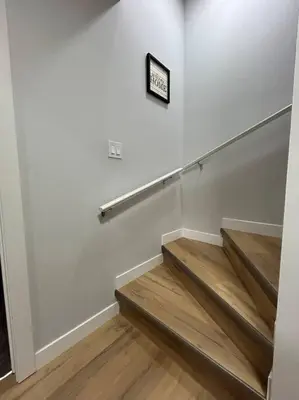 a staircase in a room with a sign on the wall at Comfortable and centrally located guest suite in Calgary