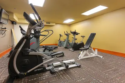 a gym with several exercise bikes in a room at Slalom Creek 3 Bedrooms in Rossland