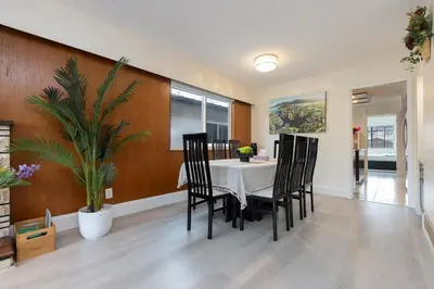 a dining room with a table and chairs at Vancouver Getaway in Vancouver
