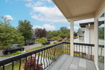 a balcony with a view of a parking lot at Vancouver Getaway in Vancouver