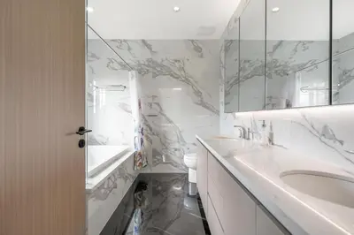 a white bathroom with a sink and a mirror at Charming and Modern Retreat in Vancouver Trendy 42nd Avenue Neighbourhood in Vancouver