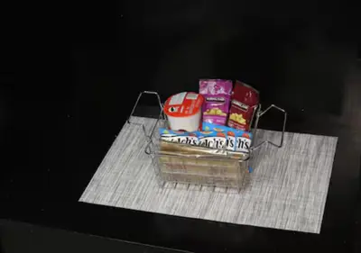 a basket filled with books on a table at Calgary's Home Cinema Retreat in Calgary