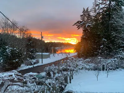 a winter sunset with snow on the ground at Silva Bay View BnB in Gabriola