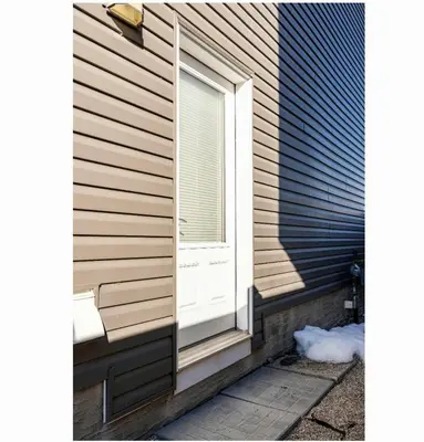 a window on the side of a house at Basement Apartment in Calgary